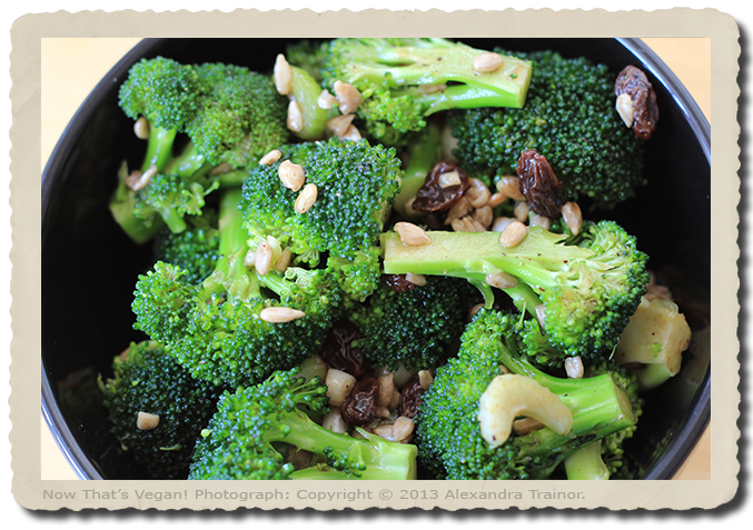 A broccoli salad with raisins and seeds.