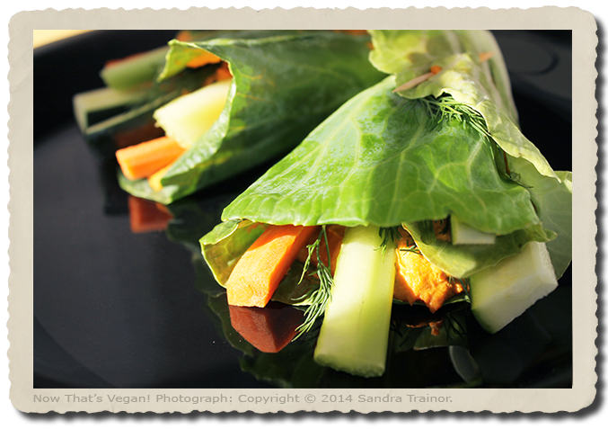 A salad with hot red pepper dip wrapped in cabbage leaves.
