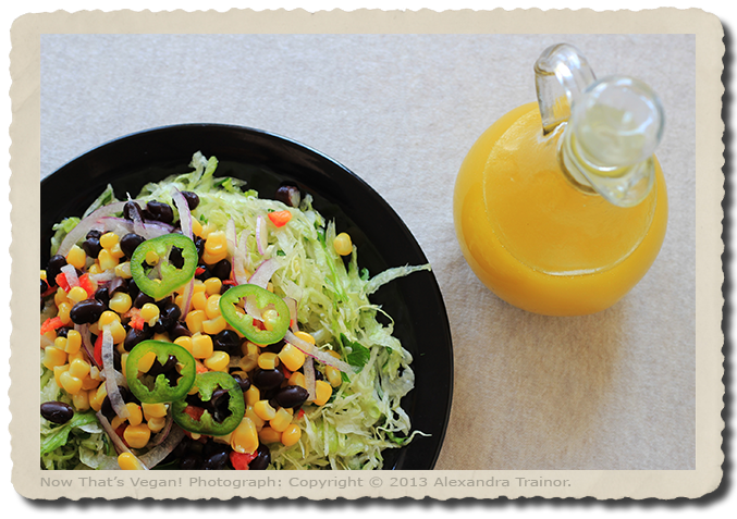 A shredded lettuce salad with Mexican toppings and citrus dressing.