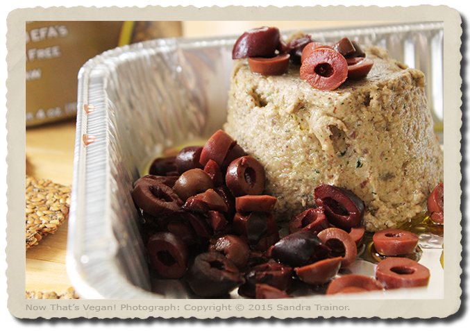 An vegan appetizer or snack, made with seeds and olives.