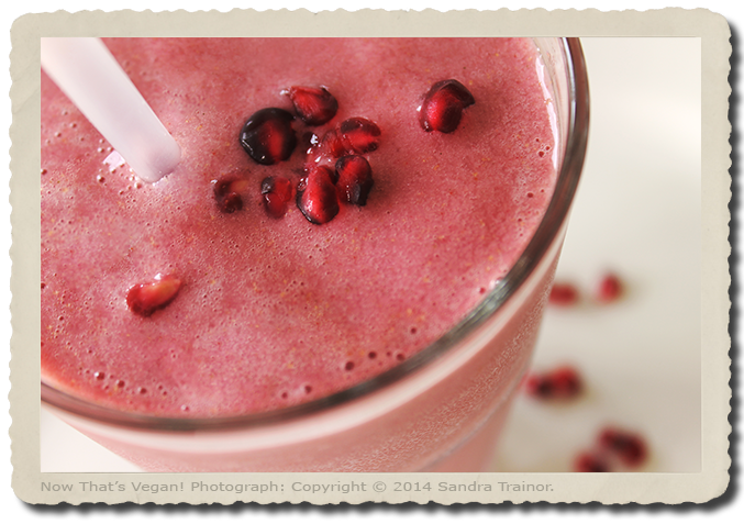 A smoothie, rich in vitamin C, made with Pomegranate juice and seeds, strawberries, and more.