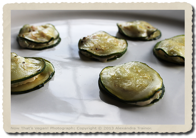 A raw (uncooked) food recipe that uses zucchini and a vegan nut cheese.